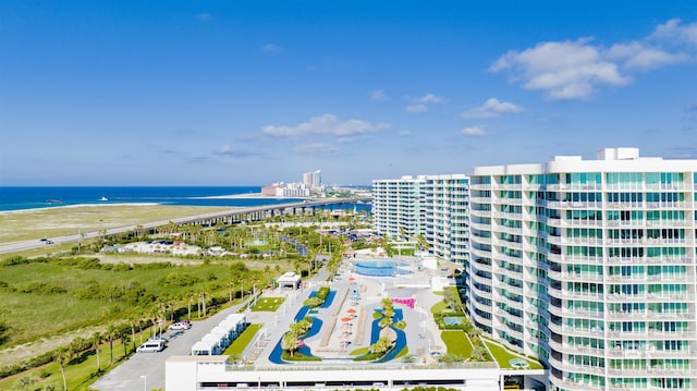 bird's eye view featuring a water view and a beach view