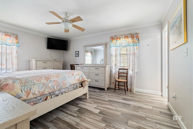 1101 Alabama Ave, Dauphin Island, AL 36528 - bedroom featuring crown molding, light wood finished floors, baseboards, and ceiling fan
