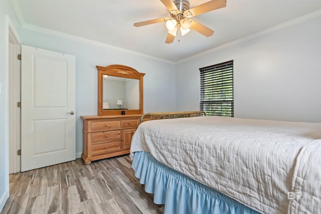 1101 Alabama Ave, Dauphin Island, AL 36528 - bedroom featuring light wood finished floors, crown molding, and ceiling fan