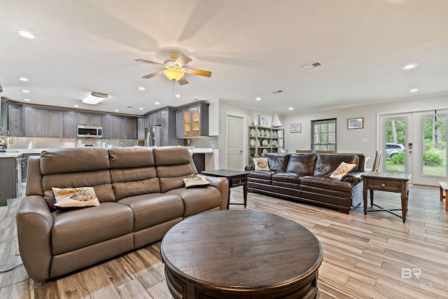 1101 Alabama Ave, Dauphin Island, AL 36528 - living area with light wood-style floors, crown molding, a ceiling fan, and recessed lighting