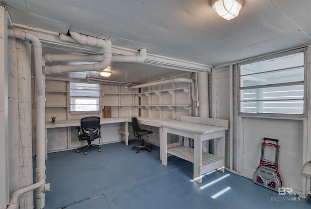 office featuring a workshop area and concrete floors