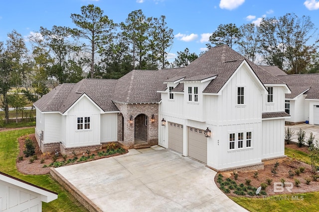 modern farmhouse style home featuring a garage