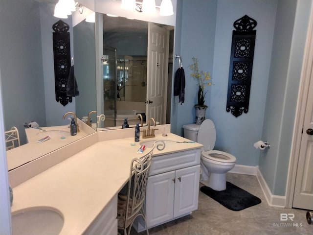 bathroom with double sink vanity, tile floors, and toilet