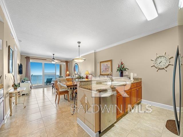 interior space featuring ceiling fan and sink