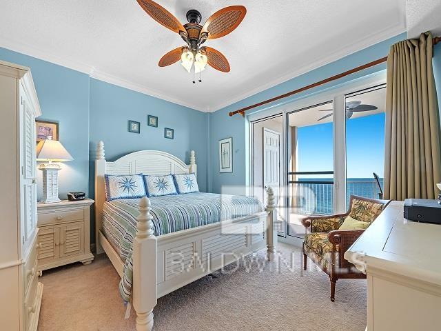 bedroom featuring ceiling fan, ornamental molding, and light carpet