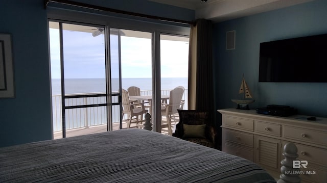 bedroom featuring a water view