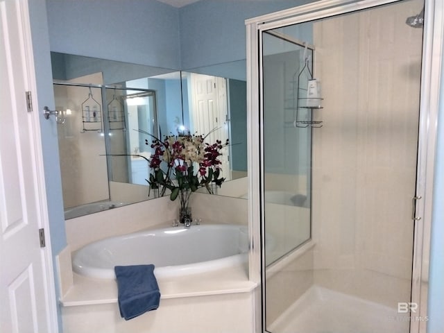 bathroom with separate shower and tub