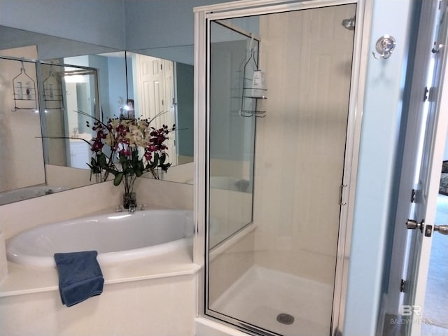 bathroom with shower with separate bathtub