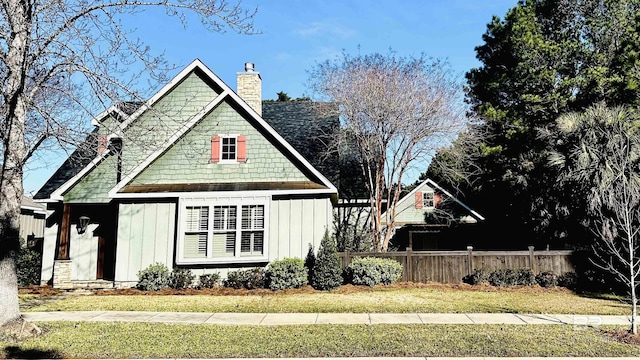 view of side of property featuring a yard