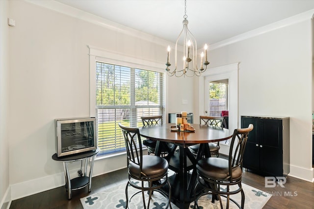 dining room with a chandelier, heating unit, dark hardwood / wood-style floors, and crown molding