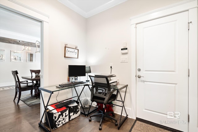 home office with crown molding and dark wood-type flooring