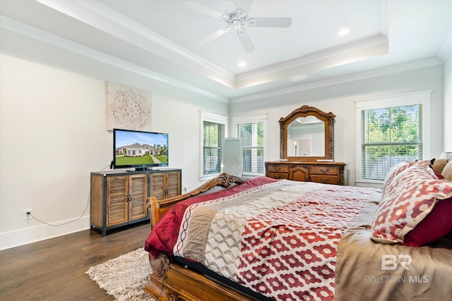 bedroom featuring ornamental molding, a raised ceiling, ceiling fan, and dark wood-type flooring