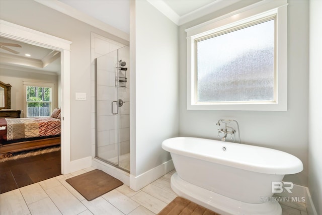 bathroom with crown molding and independent shower and bath