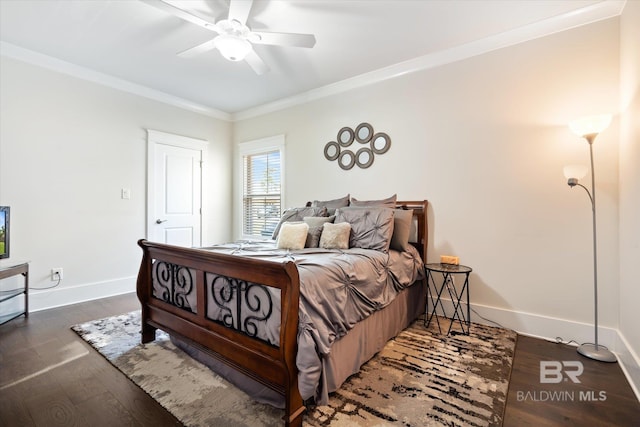 bedroom with dark hardwood / wood-style flooring, ceiling fan, and crown molding