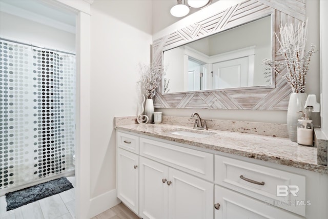 bathroom featuring curtained shower, hardwood / wood-style floors, vanity, and toilet