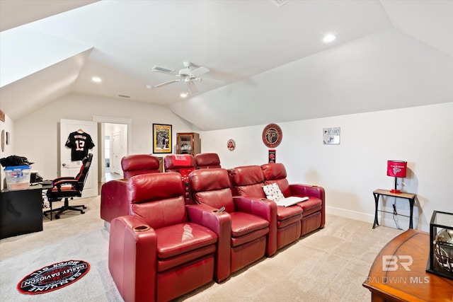 home theater featuring ceiling fan, light carpet, and vaulted ceiling