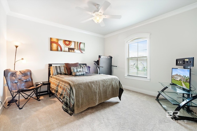 carpeted bedroom with ceiling fan and crown molding