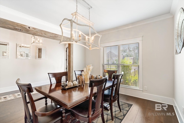 dining area featuring a notable chandelier, dark hardwood / wood-style floors, and crown molding