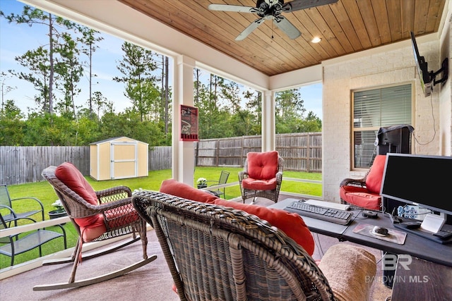 exterior space with ceiling fan, an outdoor hangout area, and a storage shed