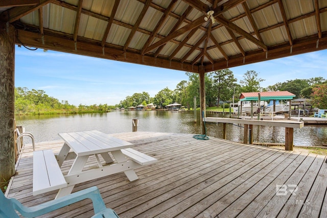 view of dock featuring a gazebo and a water view