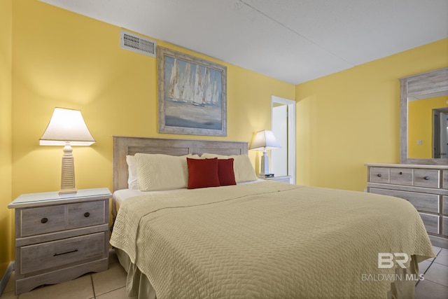 bedroom featuring light tile patterned floors