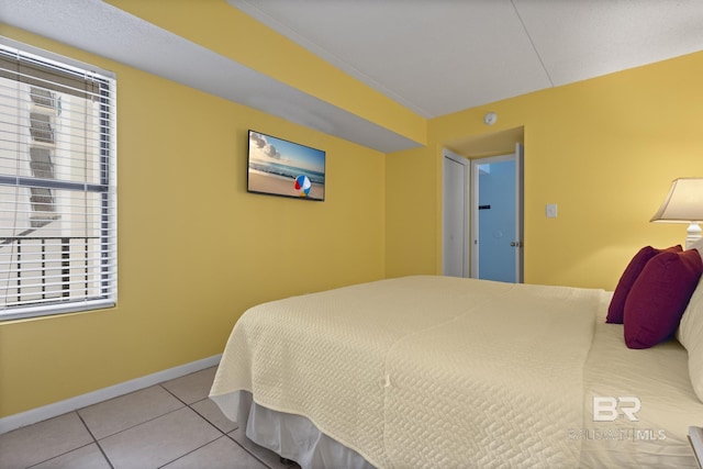 bedroom featuring light tile patterned floors