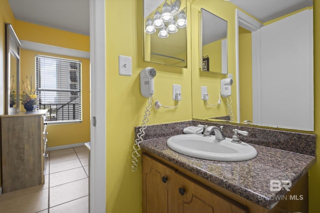 bathroom featuring tile patterned flooring and vanity