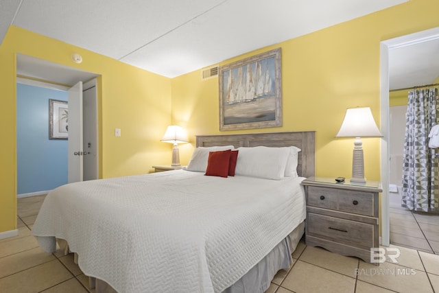 bedroom with light tile patterned flooring