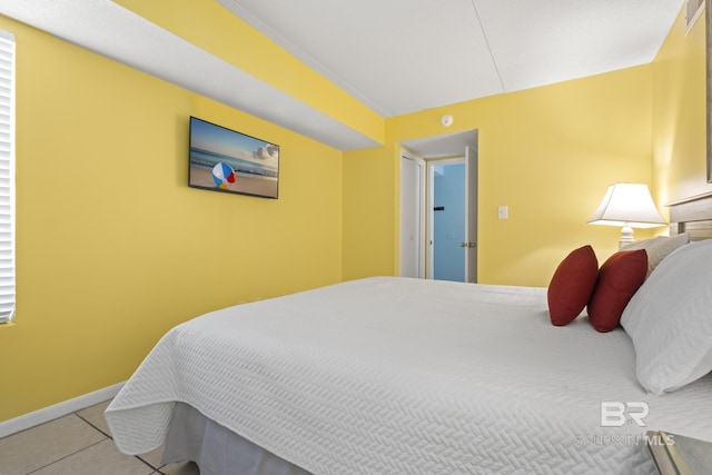 bedroom featuring light tile patterned flooring