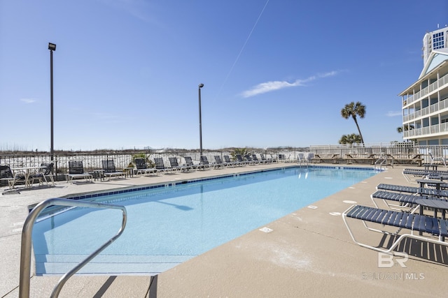 view of swimming pool featuring a patio area