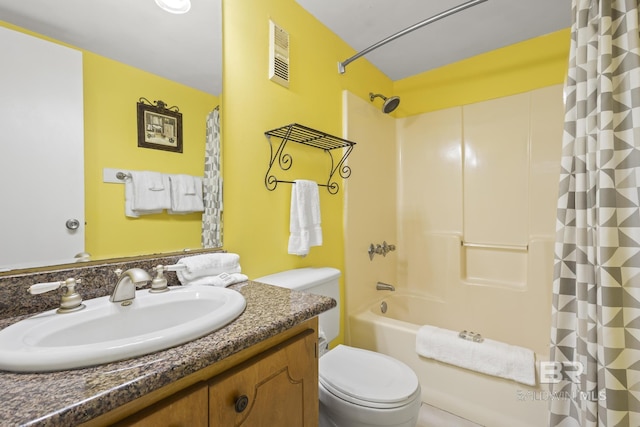 full bathroom with vanity, toilet, and shower / bath combo with shower curtain