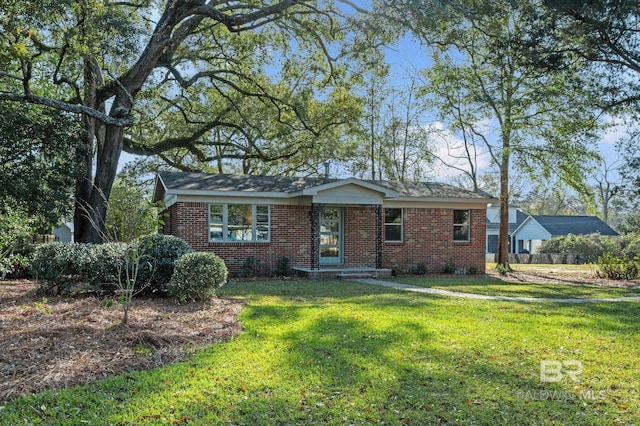 single story home with brick siding and a front lawn