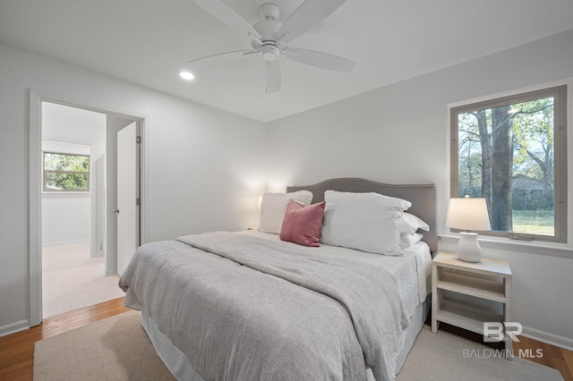 bedroom featuring recessed lighting, a ceiling fan, baseboards, and wood finished floors