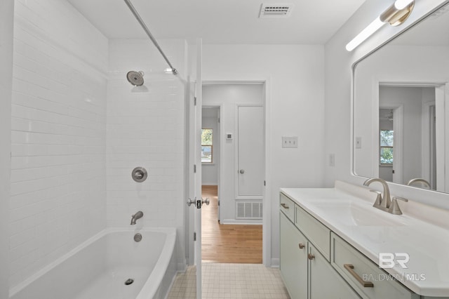 full bathroom featuring visible vents, vanity, and shower / bathtub combination