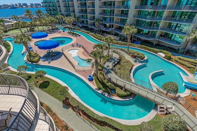 view of swimming pool with a water view