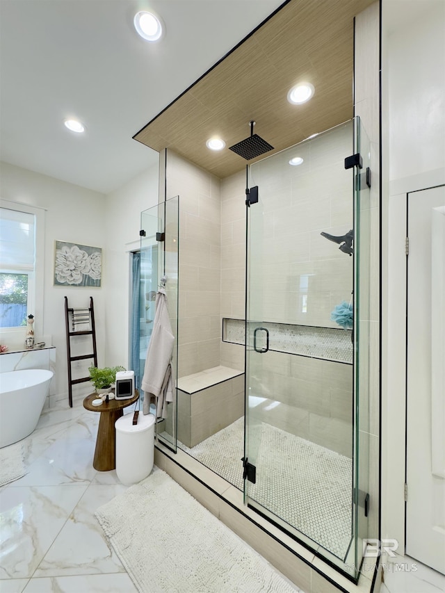 900 Hand Ave, Bay Minette, AL 36507 - bathroom featuring a shower stall, recessed lighting, a freestanding tub, and marble finish floors