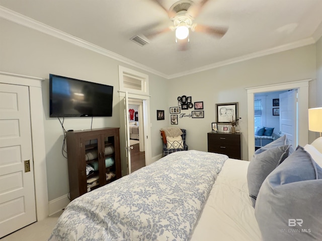 900 Hand Ave, Bay Minette, AL 36507 - bedroom with crown molding, baseboards, a ceiling fan, and carpet
