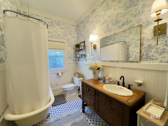 900 Hand Ave, Bay Minette, AL 36507 - full bath with ornamental molding, a wainscoted wall, toilet, vanity, and a shower with shower curtain