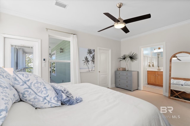 bedroom featuring ensuite bathroom, light colored carpet, ceiling fan, and ornamental molding