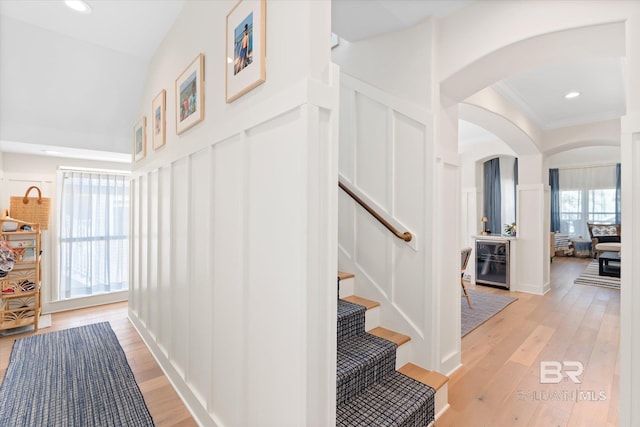 hallway featuring light hardwood / wood-style floors and beverage cooler