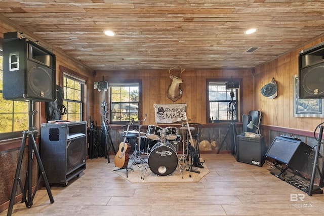 misc room with wooden walls, light hardwood / wood-style flooring, and wood ceiling