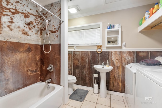 full bathroom with washing machine and clothes dryer, tile patterned flooring, toilet, shower / bathtub combination, and ornamental molding