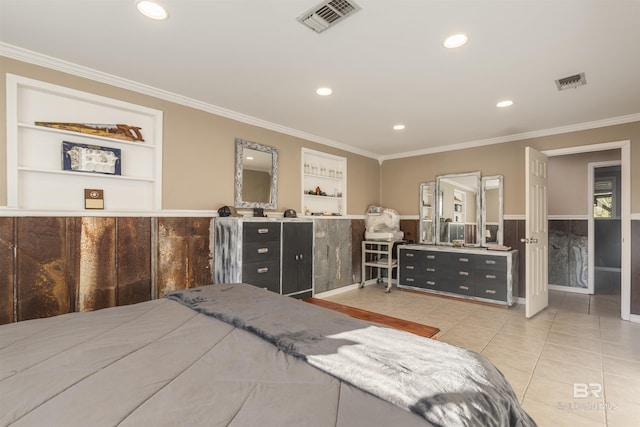 bedroom with crown molding and light tile patterned floors