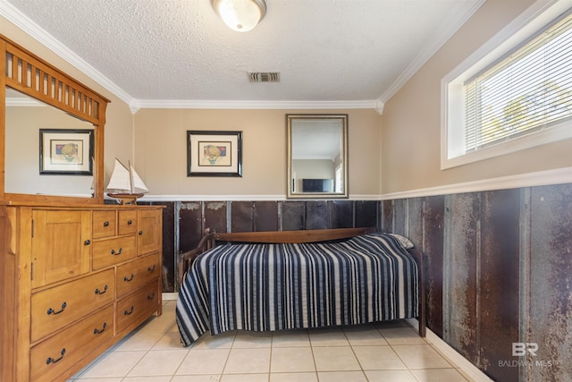 tiled bedroom featuring a textured ceiling and ornamental molding