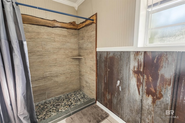 bathroom featuring curtained shower, crown molding, and tile patterned flooring