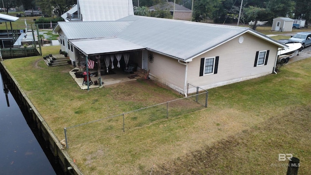 exterior space with a lawn and a patio