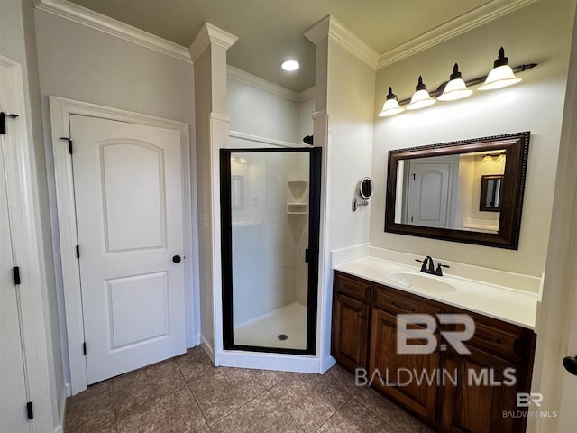 bathroom featuring vanity, tile patterned flooring, crown molding, and a shower with door