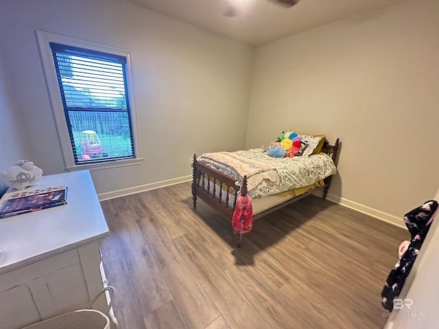 bedroom with hardwood / wood-style flooring and ceiling fan