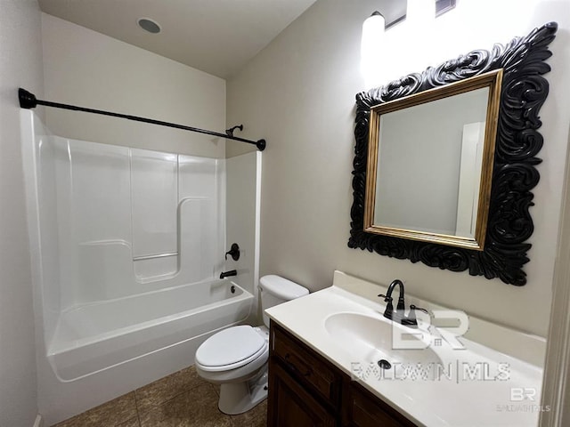 full bathroom featuring vanity, tile patterned floors,  shower combination, and toilet