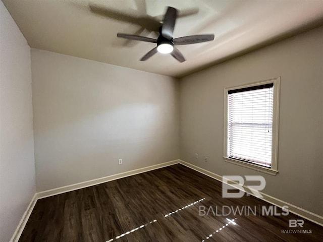 unfurnished room with ceiling fan and dark hardwood / wood-style floors